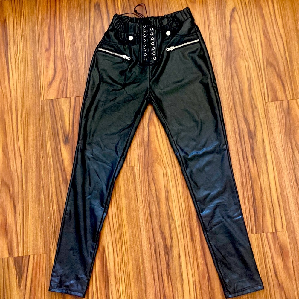 Black faux leather pants with lace up